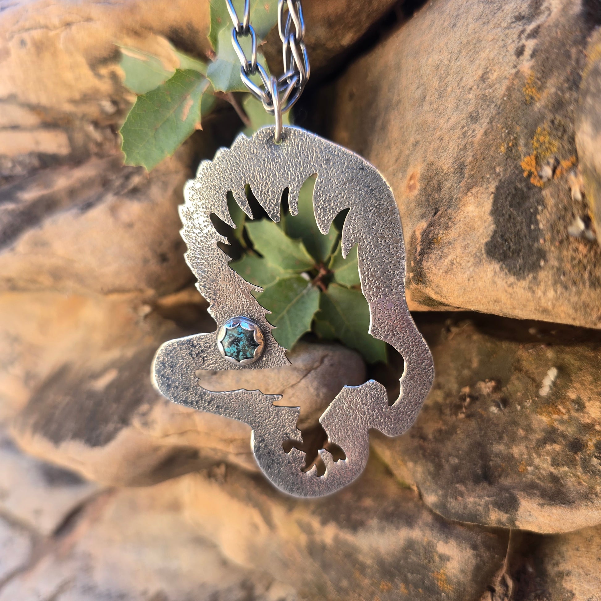 Bird landing silhouette oxidized sterling silver pendant with turquoise accent textured surface and large bail for thick chain
