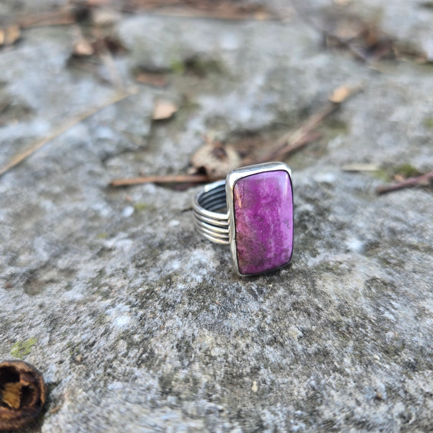 sterling and cobalto calcite ring displayed on rock