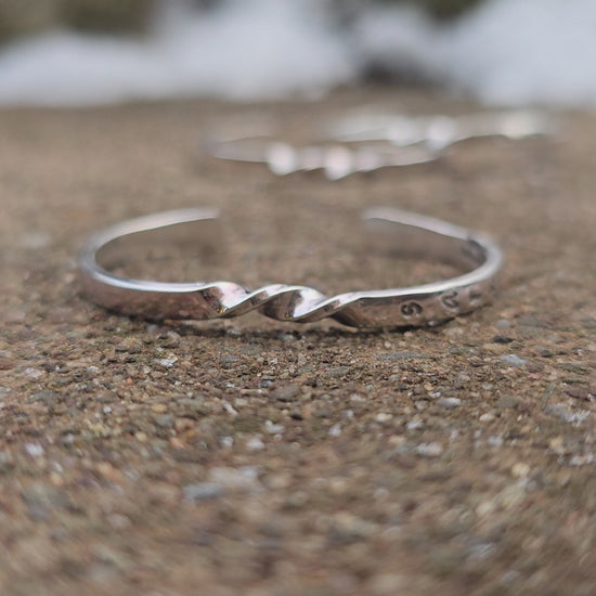 Handmade sterling silver baby cuff bracelet with custom stamping, crafted by Sterling Roots.