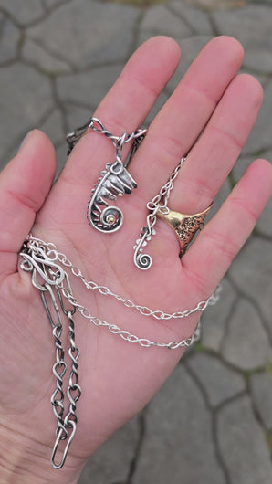 fern frond pendant with gold accent and dainty fern frond pendant displayed with handmade chains