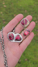 Load and play video in Gallery viewer, red dahlia mohave rings, two-stone pendant, and oxidized twisted link chain displayed together on hand
