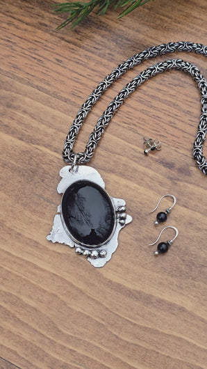 video of black onyx pendant, threader earrings, and post earrings being rotated for display