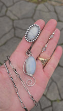 Load and play video in Gallery viewer, Rainbow Moonstone Collection, including moonstone threader earrings, a windswept-inspired pendant, a beaded moonstone ring, and a handmade twisted link chain.
