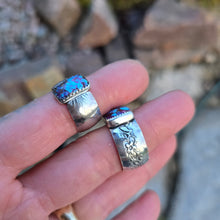 Load image into Gallery viewer, angled view of purple Mohave turquoise rings showing stone color and band details
