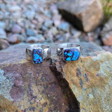 Load image into Gallery viewer, close-up of pair of wide band ring featuring purple Mohave turquoise stone

