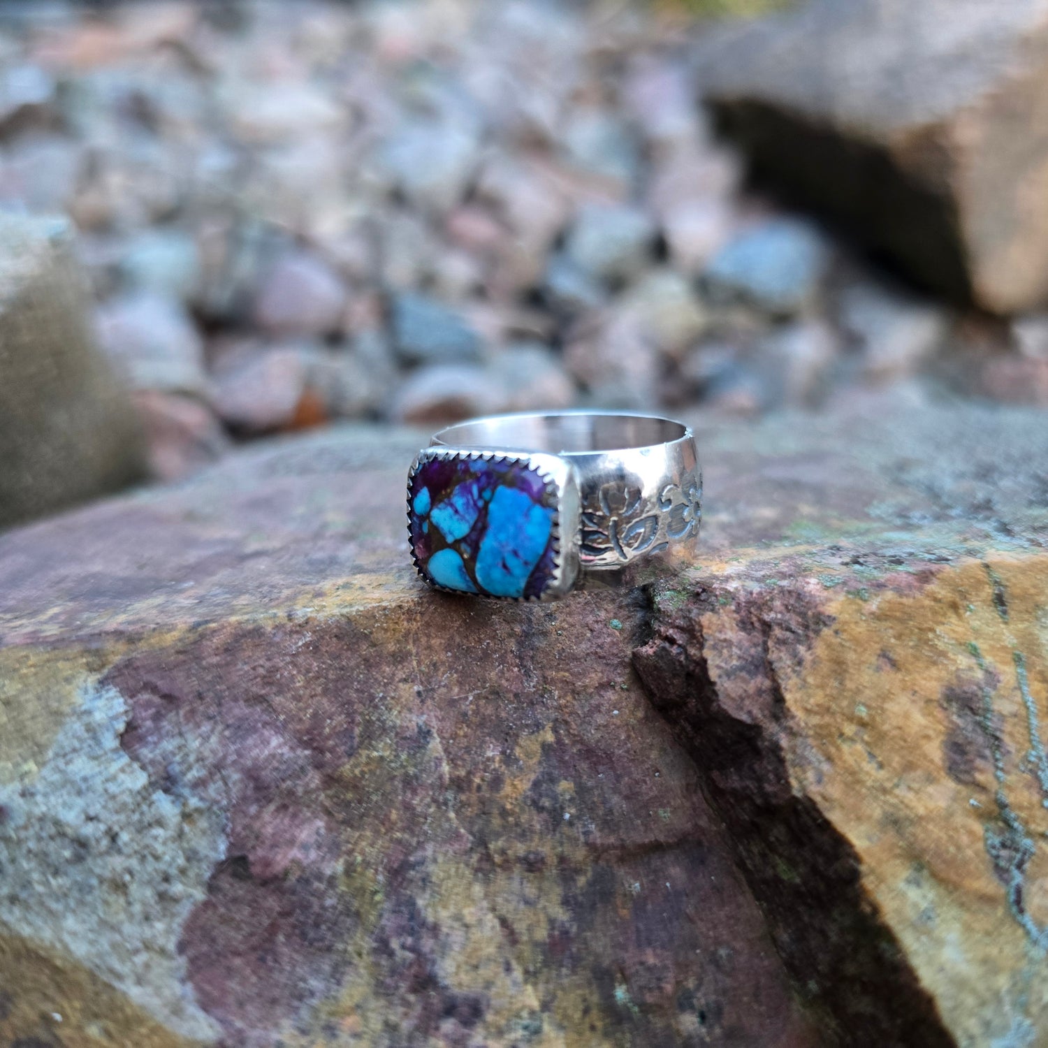 close-up of wide band ring featuring purple Mohave turquoise stone