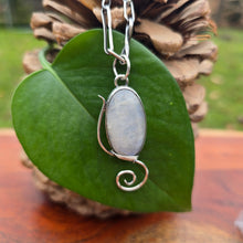 Load image into Gallery viewer, Rainbow moonstone pendant with a windswept-inspired sterling silver design, showcasing shifting iridescence.
