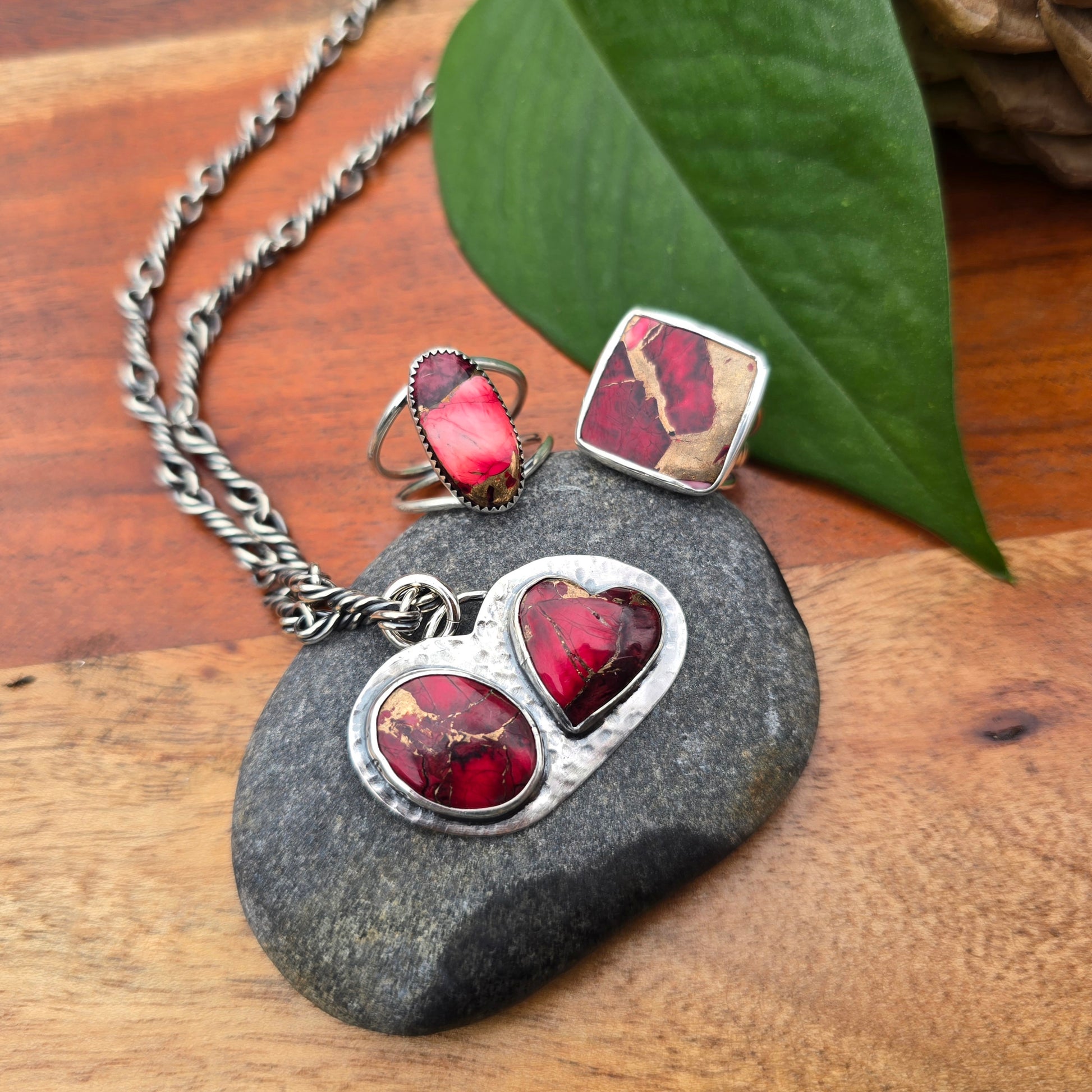 red dahlia mohave oval ring, square ring, double-stone pendant, and oxidized twisted link chain displayed together
