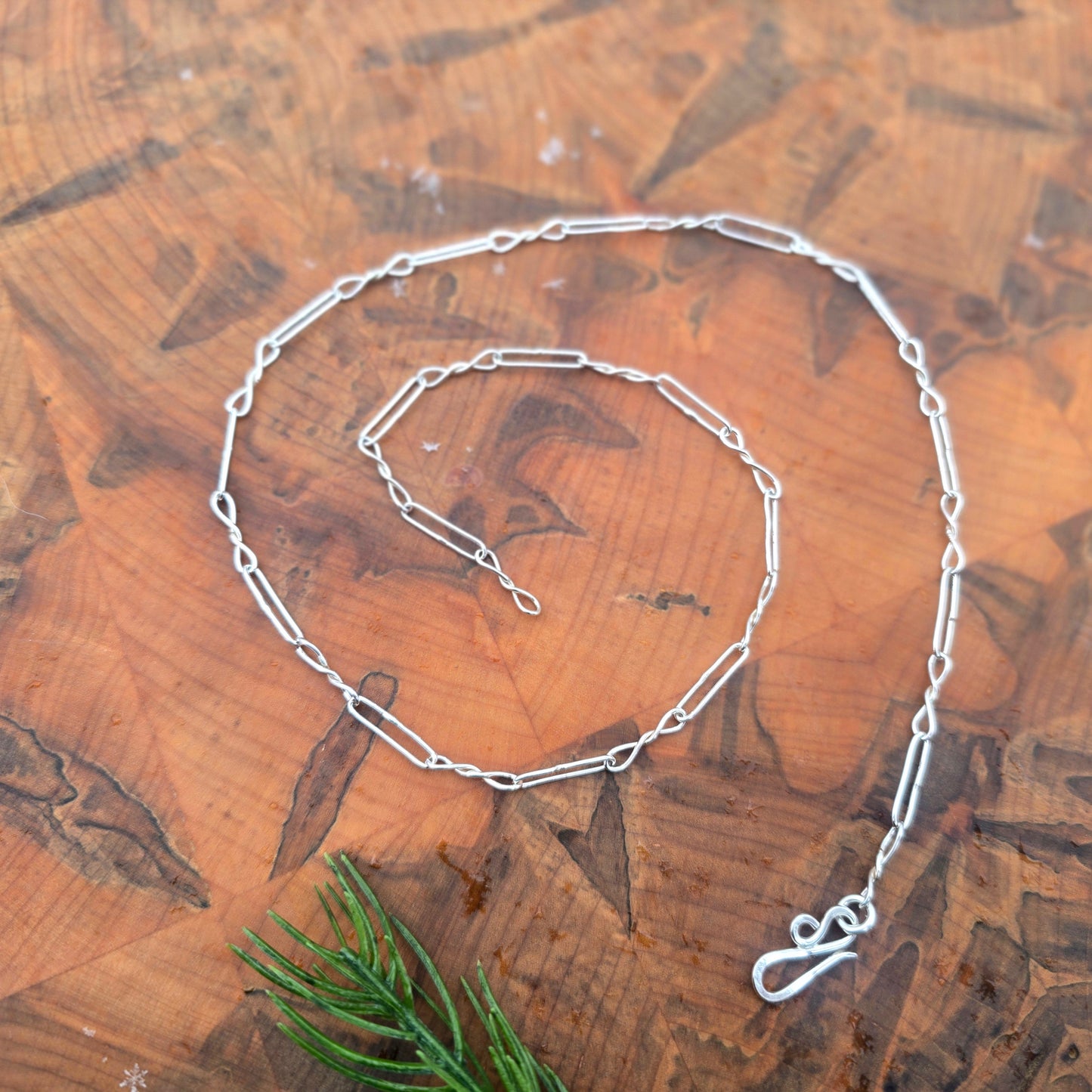 Shiny sterling silver chain with twisted links and paperclip links