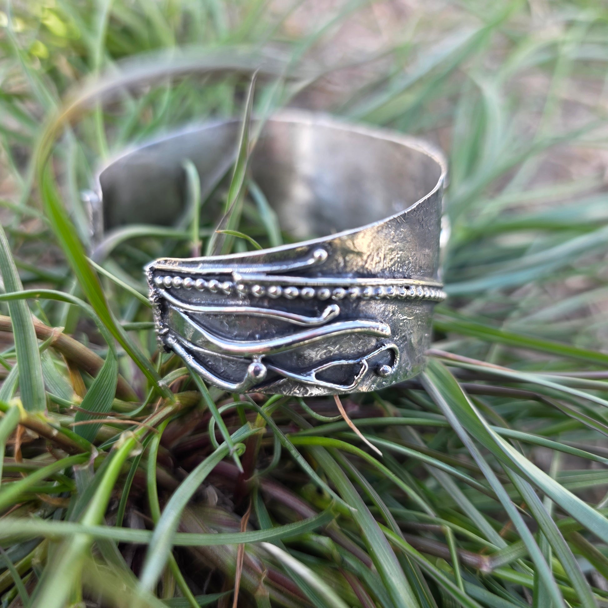 sterling silver cuff bracelet with water grasses side view