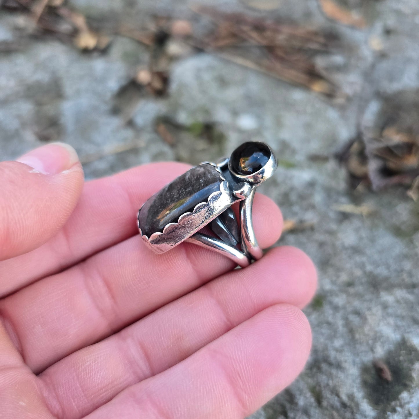 sterling obsidian and black onyx statement ring displayed on hand 