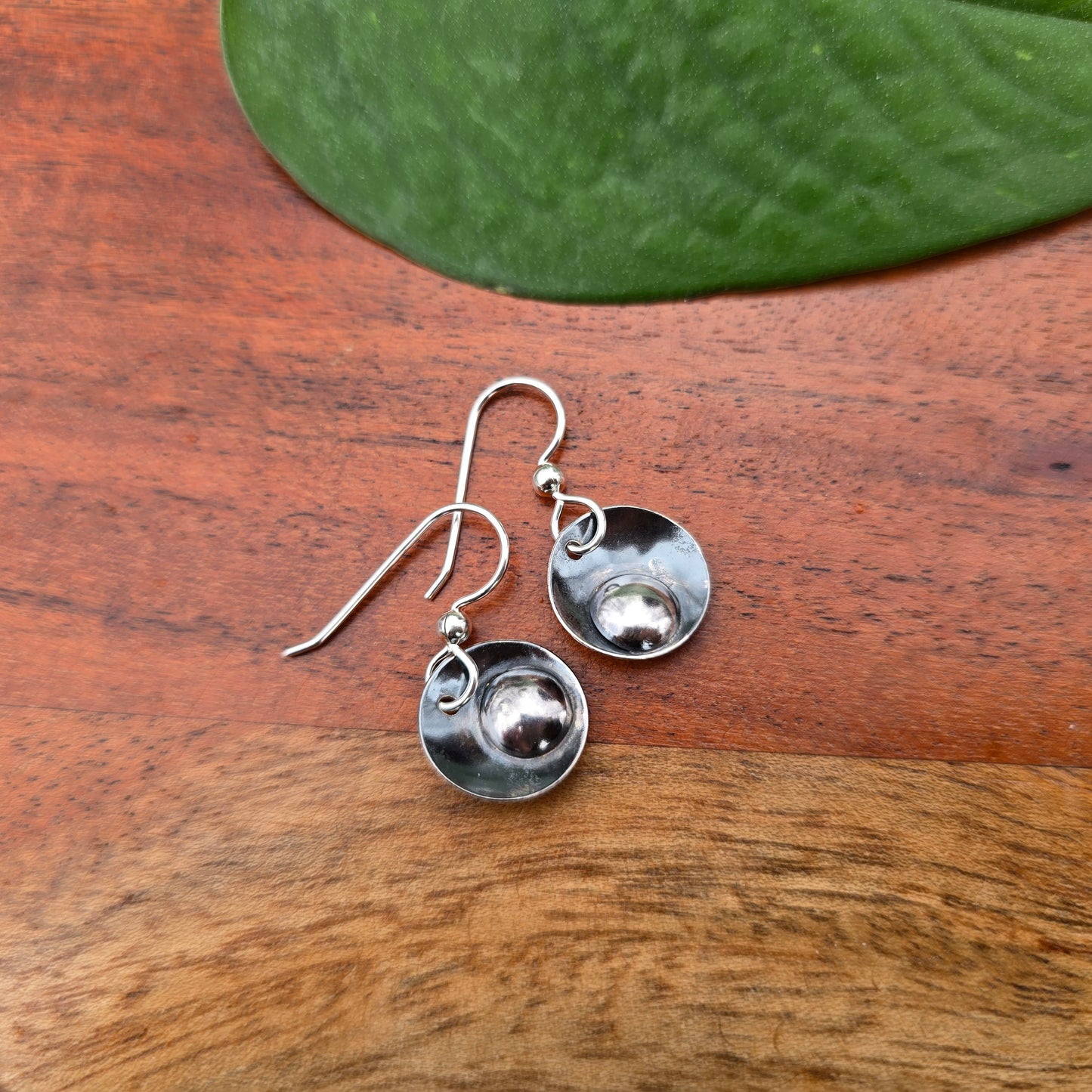 pair of sterling silver earrings each featuring a single drop element