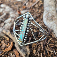 Load image into Gallery viewer, Hand-forged statement sterling silver cuff with rectangular turquoise stone angled view
