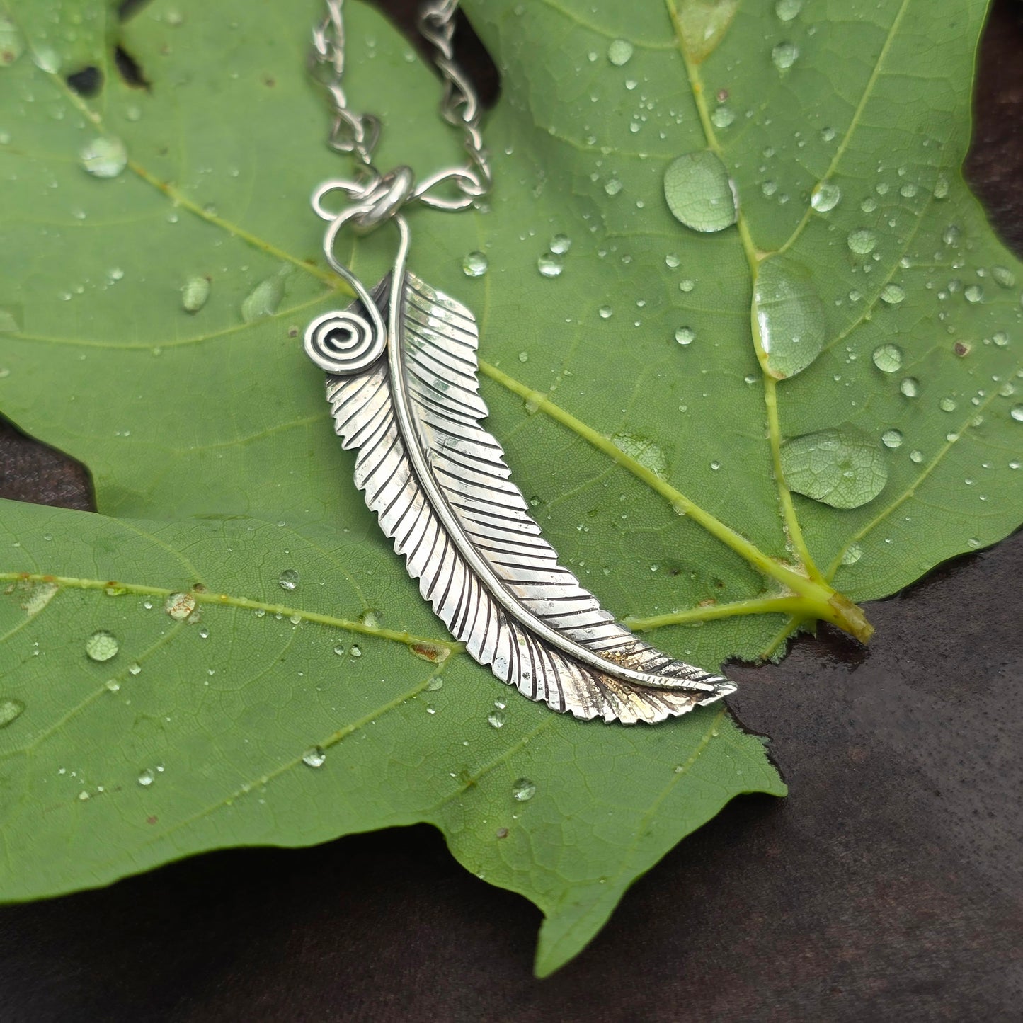 Hand-Forged Sterling Silver Feather Pendant with 18 Karat Gold Dust