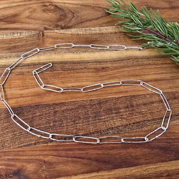 dainty sterling silver hammered paperclip link chain detailed view from top