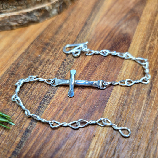 Hand-forged sterling silver cross bracelet with adjustable fit