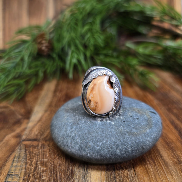 sterling silver elk ivory ring with feather wrap design shown from front view