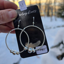 Load image into Gallery viewer, beaded hoop sterling silver earrings displayed on surface
