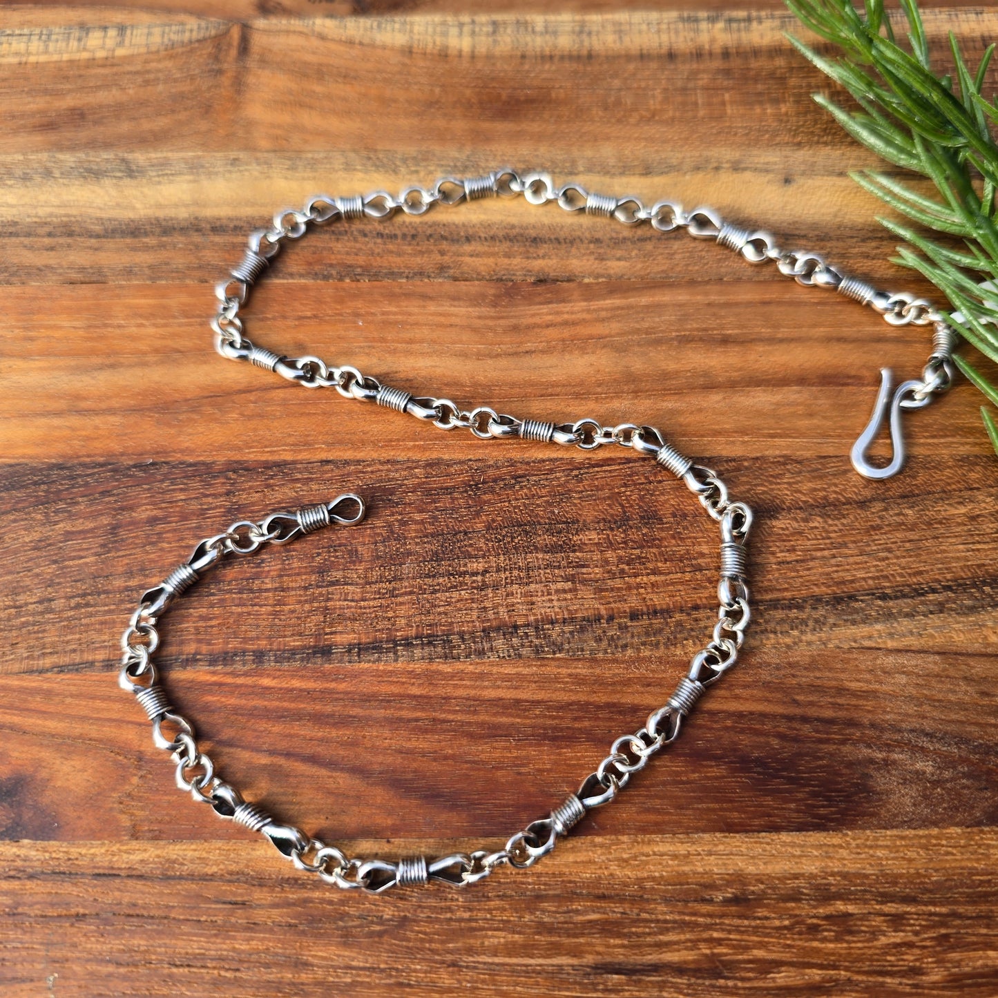 sterling silver oxidized bowtie and jump ring chain detailed view from top