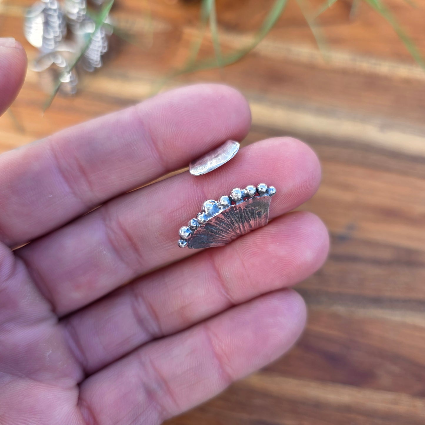 Sterling silver pearl ridge adjustable ring displayed on finger