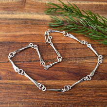 Load image into Gallery viewer, sterling silver shiny raven and ring short chain detailed view from top
