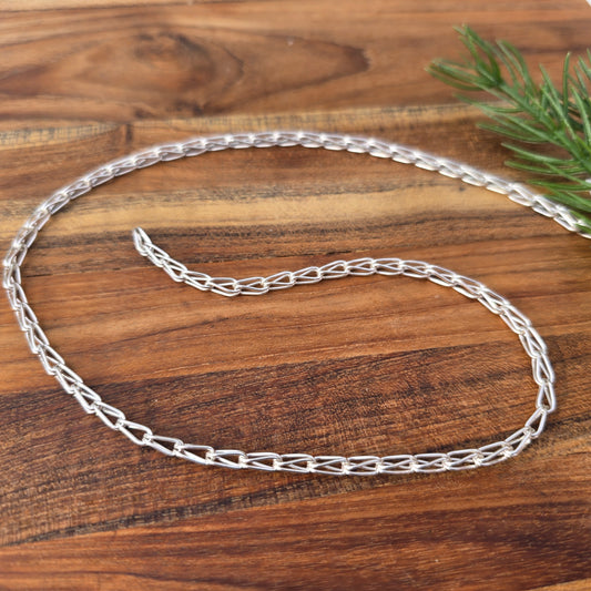 sterling silver shiny loop in loop chain detailed view from front