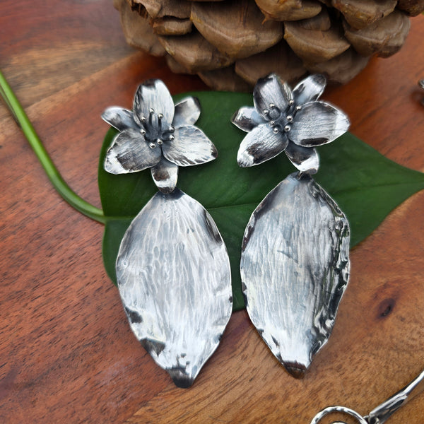 large sterling silver trillium earrings featuring trillium flowers with leaf drop accents