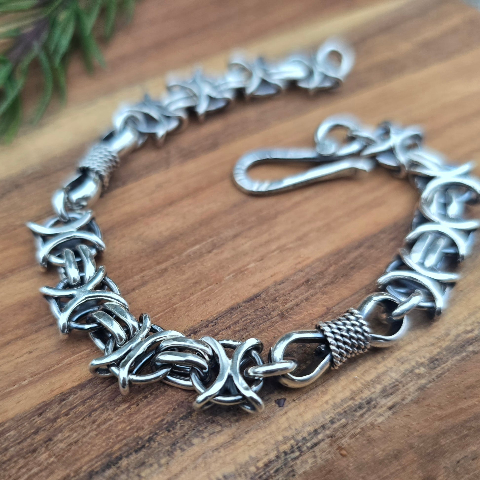 Oxidized sterling silver bracelet with X O and bowtie links