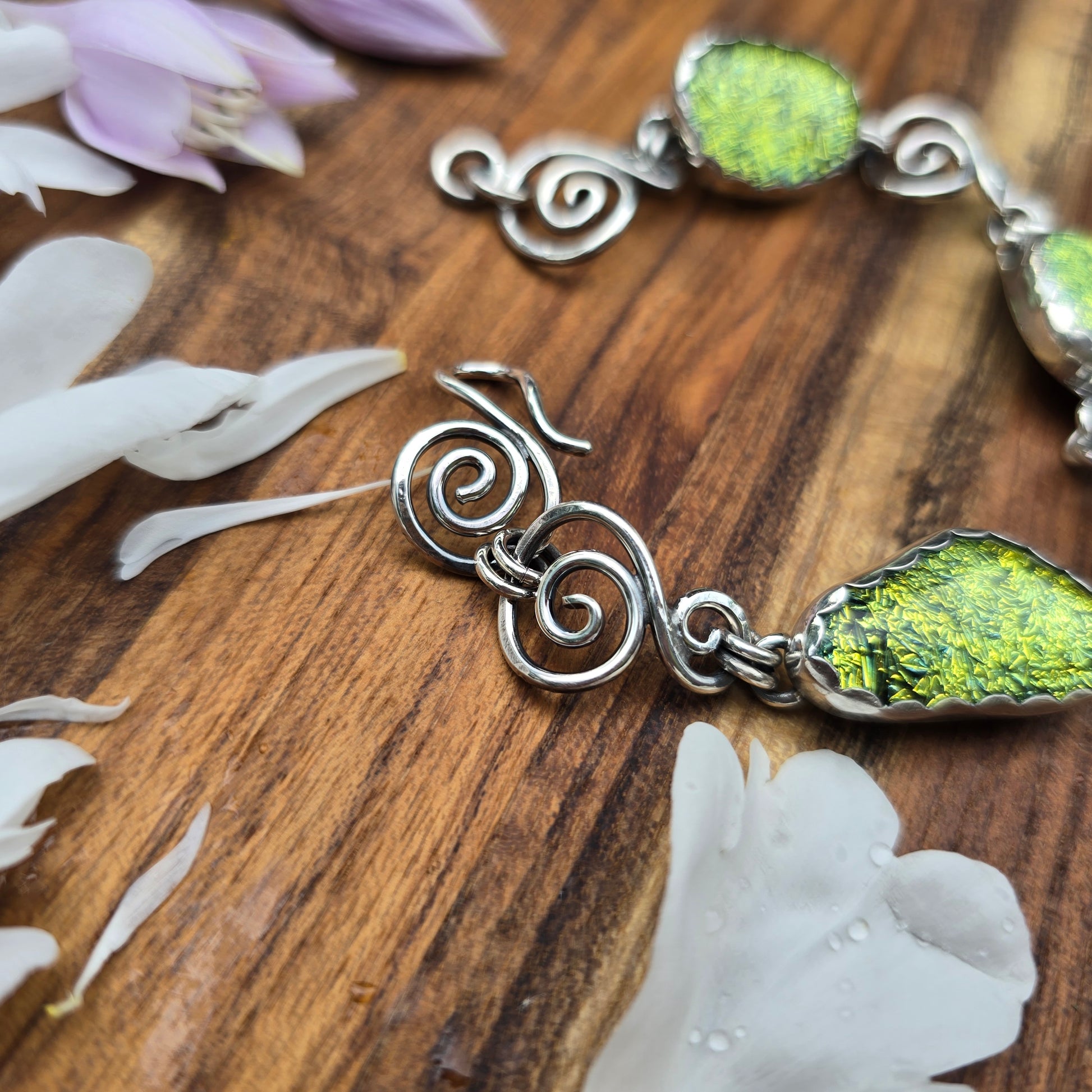 Sterling silver swirl and yellow dichroic bracelet detailed view